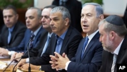 Israel's Prime Minister Benjamin Netanyahu, second right, chairs the weekly Cabinet meeting in Jerusalem, Dec. 6, 2015. 