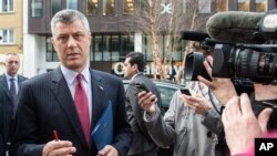 Kosovo's Prime Minister Hashim Thaci talks with journalists as he arrives for a meeting with EU foreign policy chief Catherine Ashton at the European Diplomatic Service headquarters in Brussels, April 17, 2013.