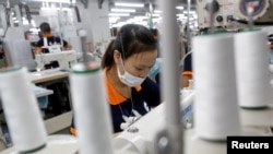 Laborers work at TAL Apparel Vietnam Garments factory in Vinh Phuc province, north of Hanoi, Vietnam, Oct. 20, 2016. 