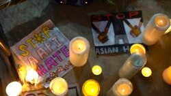 People lights candles as they attend a peace vigil to mourn the victims of anti-Asian hate crimes at Almansor Park, Los Angeles, California, U.S., March 21, 2021.