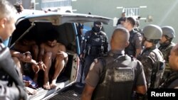 Suspects are arrested after violent clashes with Brazilian Army soldiers in Rio de Janeiro, Brazil, Aug. 20, 2018.