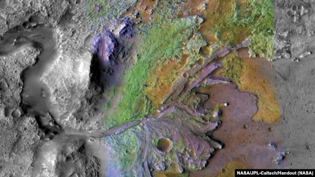 FILE: Formations made by water and sediment are seen in the Jezero Crater on Mars, the landing site for the Perseverance rover, in this false color image taken by NASA, published on May 15, 2019 and obtained November 15, 2019. (NASA/JPL-Caltech/Handout)