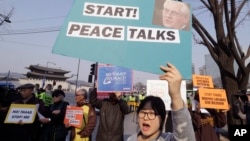 FILE - South Korean protesters stage a rally opposing a visit of U.S. Secretary of State Rex Tillerson as they wait for his arrival in front of the government complex in Seoul, March 17, 2017