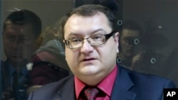 FILE - In this grab taken from Associated Press Television footage on Tuesday, Nov. 3, 2015, Yuri Grabovsky speaks during a trial hearing at the Holosiivskyi District Court in Kiev, Ukraine. A lawyer for two Russian servicemen on trial in Ukraine has been found dead. Yuri Grabovsky was representing Alexander Alexandrov and Yevgeny Yerofeyev who were captured last year in the rebel-held eastern Ukraine. 