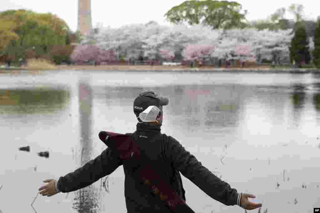 A man stretches at the Yuyuantan Park in Beijing, China.