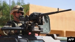 French troops patrol in the streets of Gao on February 3, 2013 as France jets carried out major air strikes today near Kidal.