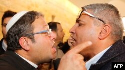 FILE: Jewish Power party's Itamar Ben Gvir (L) argues with the Israeli Arab candidate Ata Abu Medeghem of Raam-Balad after a hearing at the Israeli Supreme Court in Jerusalem, on March 14, 2019.