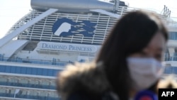 The Diamond Princess cruise ship, in quarantine due to fears of new COVID-19 coronavirus, is seen at Daikoku pier cruise terminal in Yokohama on February 21, 2020. - Hundreds of people have been allowed to leave the ship after testing negative for the dis