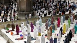 Indonesian Muslims pray spaced apart as they practice social distancing to curb the spread of the new coronavirus during an evening prayer at Istiqlal Mosque in Jakarta, Indonesia. Monday, April 12, 2021. (AP Photo/ Achmad Ibrahim)