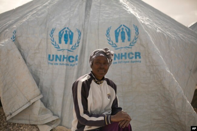 FILE - Gailon Lawson, from Trinidad and Tobago, poses for a portrait at al-Hol camp in Hassakeh province, Syria, March 31, 2019.