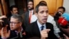 Venezuelan opposition leader and self-proclaimed interim president Juan Guaido talks to the media before a session of the Venezuela’s National Assembly in Caracas, Venezuela, Jan. 29, 2019.