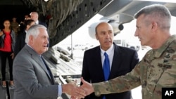 Secretary of State Rex Tillerson is greeted by Gen. John Nicholson, right, commander of Resolute Support, with Special Charge d'Affaires Amb. Hugo Llorens, as he arrives, Oct. 23, 2017, at Bagram Air Base, Afghanistan. 