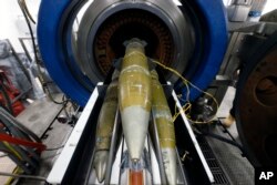 FILE - In this Jan. 29, 2015, file photo, inert 105mm shells sit in the entry point of the explosive destruction system used for destruction of leaky or otherwise problematic chemical munitions, inside the Pueblo Chemical Depot, east of Pueblo, in southern Colorado.