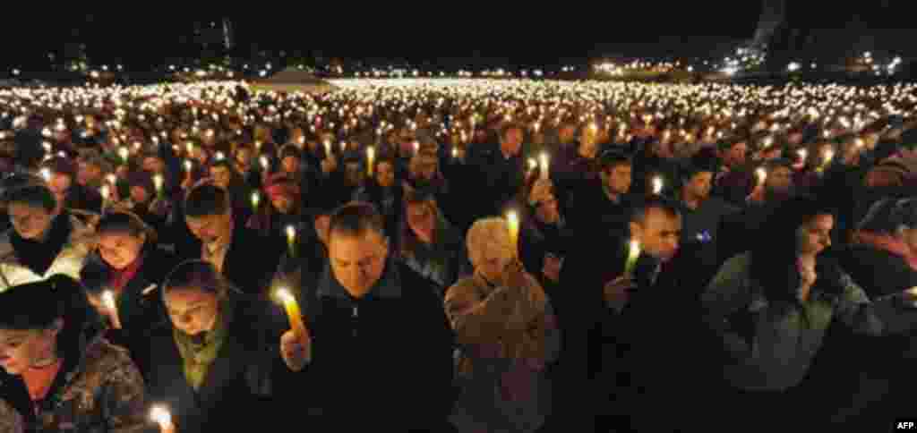 Virginia Tech students hold a candlelight vigil on the drill field, on campus, as a memorial to Virginia Tech police Officer Deriek Crouse who was gunned down Thursday during a traffic stop on the campus of Virginia Tech in Blacksburg, Va., Friday, Dec.