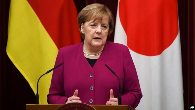 German Chancellor Angela Merkel answers a question during a joint press conference with Japanese Prime Minister Shinzo Abe following their summit meeting at Abe's official residence in Tokyo, Feb. 4, 2019.