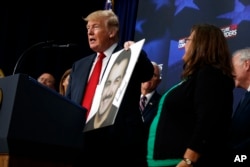 President Donald Trump speaks about immigration alongside family members affected by crimes committed by undocumented immigrants, at the South Court Auditorium on the White House complex, June 22, 2018, in Washington.