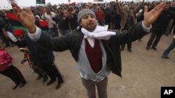 Protesters against the Libyan leader Moammar Gadhafi chant slogans during a demonstration in Benghazi, February 26, 2011