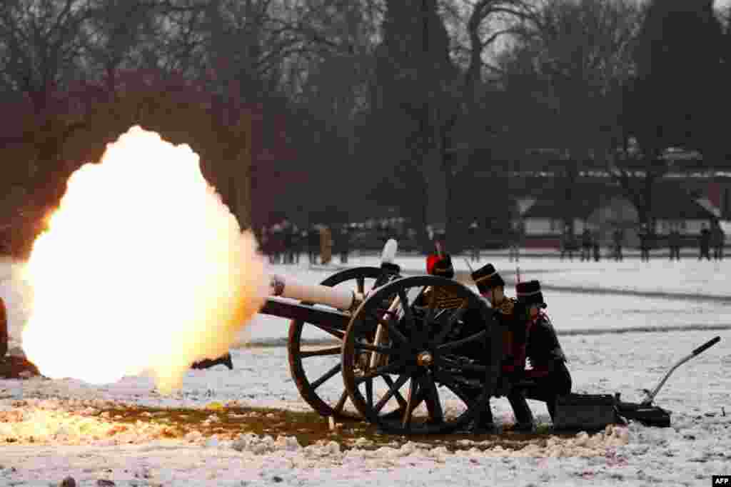The King's Troop Royal Horse Artillery fires a forty-one gun salute in central London February 6, 2012, marking the sixtieth anniversary of the Queen's ascension to the throne. (REUTERS)