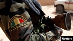 FILE - A Malian Armed Forces patch worn by a soldier is pictured during the regional anti-insurgent Operation Barkhane in Tin Hama, Mali, Oct. 19, 2017.