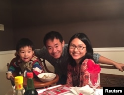 Xiyue Wang, a naturalized American citizen from China, arrested in Iran last August while researching Persian history for his doctoral thesis at Princeton University, is shown with his wife and son in this family photo.