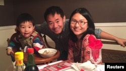 Xiyue Wang, a naturalized American citizen from China, arrested in Iran last August while researching Persian history for his doctoral thesis at Princeton University, is shown with his wife and son in this family photo released in Princeton, New Jersey, U.S. on July 18, 2017. 