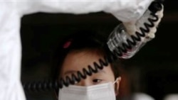 A woman being tested for radiation in Japan