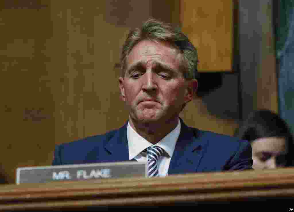 Sen. Jeff Flake speaks during the Senate Judiciary Committee hearing about Brett Kavanaugh&#39;s nomination for the Supreme Court. After a flurry of last-minute negotiations, the committee advanced Kavanaugh after agreeing to a call from Flake for a one week.