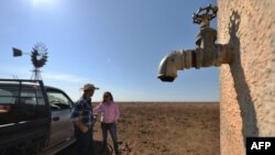 Farmers Matt and Sandra Ireson on their property, Sept. 28, 2018, during a severe and prolonged drought outside the town of Booligal in western New South Wales. Rainfall in 2018 was 75 percent below average.