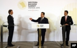 From left, Austrian Foreign Minister Sebastian Kurz, Serbian Foreign Minister Ivica Dacic and Macedonian Foreign Minister Nikola Poposki attend a news conference at the Western Balkans Summit in Vienna, Austria, Aug. 27, 2015.