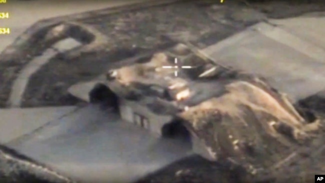 In this photo made from the footage taken from Russian Defense Ministry official website April 7, 2017, an aerial view shows shelters for aircraft at a Syrian air base after it was hit by U.S. strike in Syria.