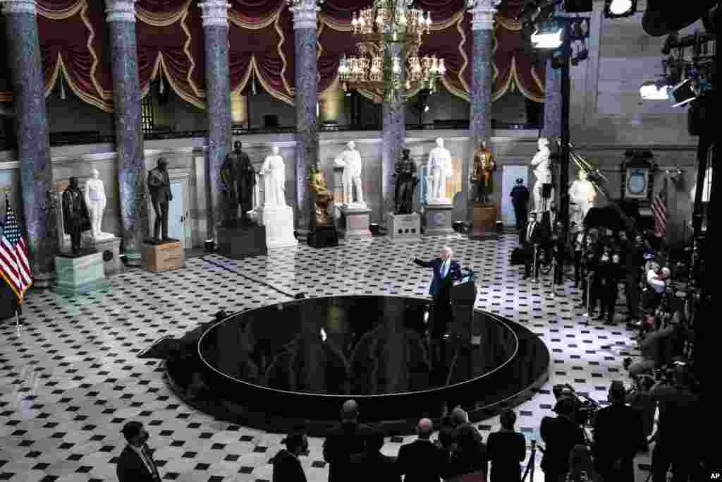 President Joe Biden speaks from Statuary Hall at the U.S. Capitol to mark the one year anniversary of the Jan. 6 riot at the Capitol by supporters loyal to then-President Donald Trump, in Washington.