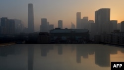 2013年1月14日北京城市已一連四日受環境污染而在拂曉時份現煙霧籠罩情形