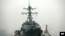 FILE - Guided missile destroyer USS Lassen arrives at the Shanghai International Passenger Quay in Shanghai, China, for a scheduled port visit. 