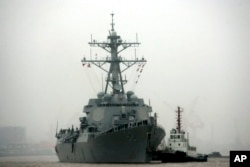 FILE - Guided missile destroyer USS Lassen arrives at the Shanghai International Passenger Quay in Shanghai, China, for a scheduled port visit.