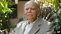 Huber Matos, 87, poses at his home Thursday, Aug. 3, 2006 in Miami. Matos, a Cuban revolutionary, had a falling out with Castro over the direction of the revolution and was jailed for 20 years before his release in 1979. He said he would return to Cuba ev