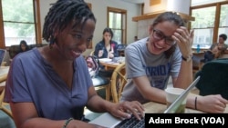 Mandisa Haarhoof reviews an essay with one of her undergraduate students.