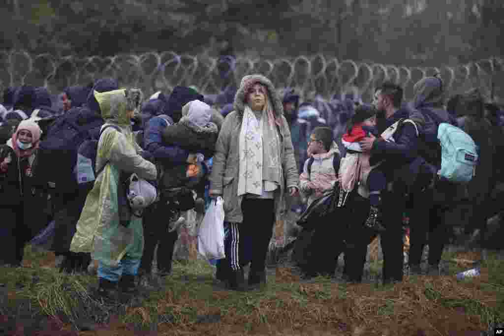 Migrants from the Middle East and elsewhere gather at the Belarus-Poland border near Grodno, Belarus.