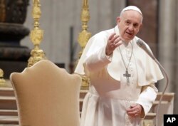 Pope Francis arrives in St. Peter's Basilica at the Vatican, Feb. 20, 2019.