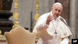 FILE - Pope Francis arrives in St. Peter's Basilica at the Vatican, Feb. 20, 2019.