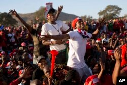 Opposition party supporters cheer opposition challenger Nelson Chamisa at a campaign rally in Bindura, Zimbabwe, July 27, 2018.