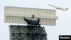 FILE: Representative illustration of an airliner taking off from an airport, with radar in the foreground. Taken 7.3.2002. 