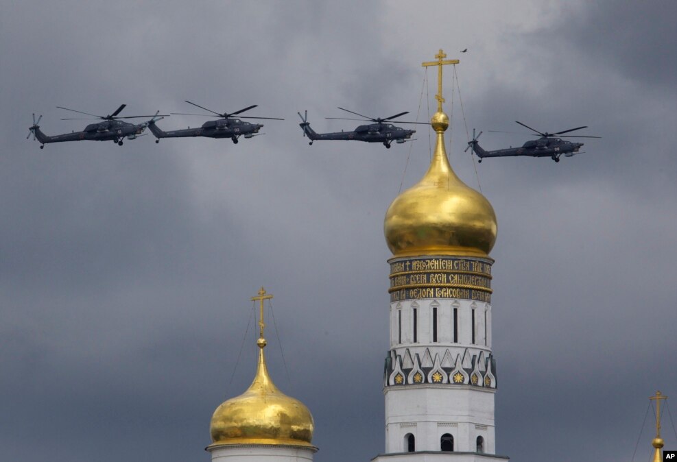 Russian military helicopters fly over Ivan the Great bell-tower and Moscow's Kremlin during a general rehearsal for the Victory Day military parade which will take place at Moscow's Red Square on May 9 to celebrate 71 years after the victory in WWII in Moscow, Russia,