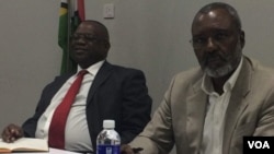 Dr. Nkosana Moyo and former cabinet minister Gorden Moyo at a public event in Zimbabwe.