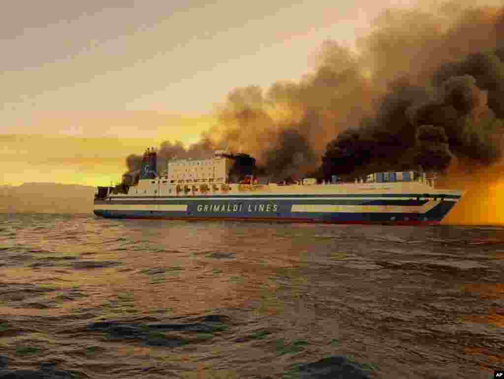 A ferry burns at the Ionian Sea near the island of Corfu, Greece. More than 280 people were evacuated from the ferry in northwestern Greece that caught fire overnight, while heading to southern Italy, authorities said.
