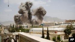 File - Smoke billows from one area after a Saudi-led airstrike on Sanaa, Yemen, April 2015.