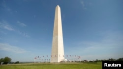 Free from its scaffolding, the Washington Monument is re-opened to the public May 12, 2014. The monument has been closed since 2011 after it suffered widespread damage caused by a 5.8 magnitude earthquake along the East Coast. REUTERS/Kevin Lamarque (UNI