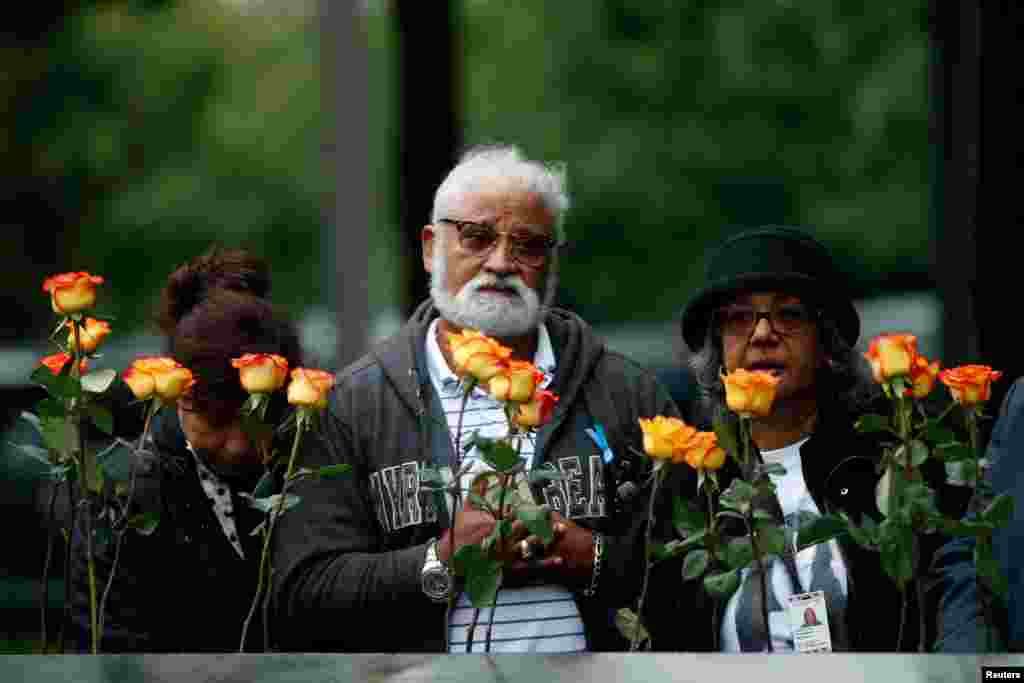 Guests mark the 17th anniversary of the 9/11 attacks on the World Trade Center, at the National 9/11 Memorial and Museum in New York, Sept. 11, 2018.