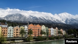 FILE - The snow-covered Nordkette mountains are pictured behind the city of Innsbruck, Austria, April 21, 2017.
