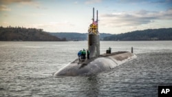 FILE - The Seawolf-class fast-attack submarine USS Connecticut departs Puget Sound Naval Shipyard in this Dec. 15, 2016, photo, provided by the U.S. Navy. 