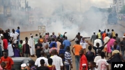 A photo taken on September 28, 2012 in Conkary, Guinea shows youth in the street during the funeral procession for two young opposition supporters killed by police during recent clashes. 